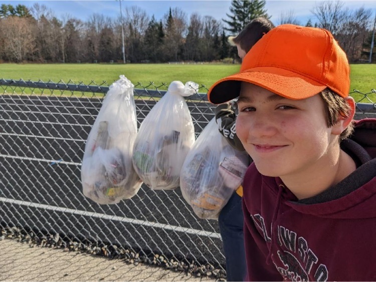 Happily picking up trash  