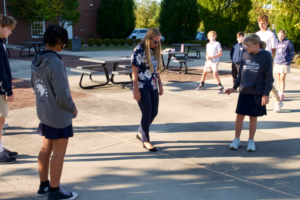 Middle division Number Line Activity teacher showing students activity