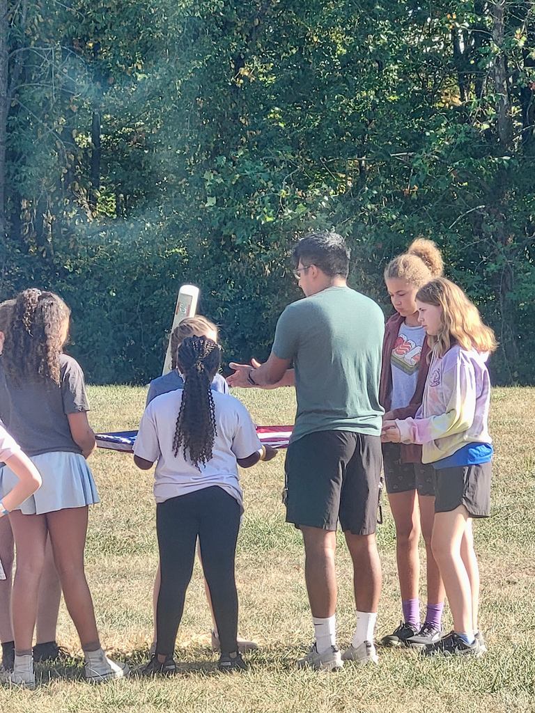 Students folding a flag