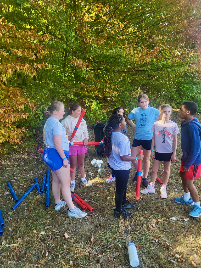 Students doing a team building exercise using building materials