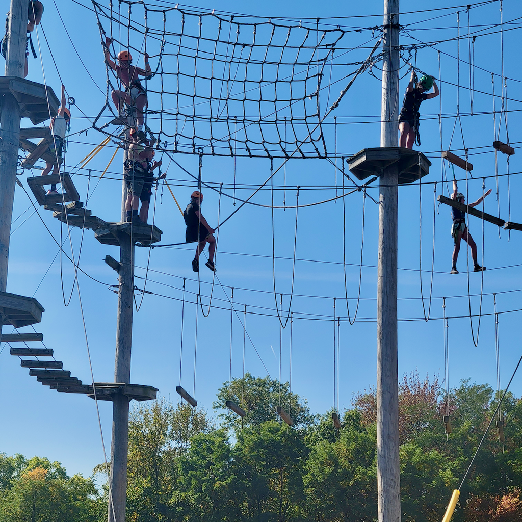 Students on a high ropes course