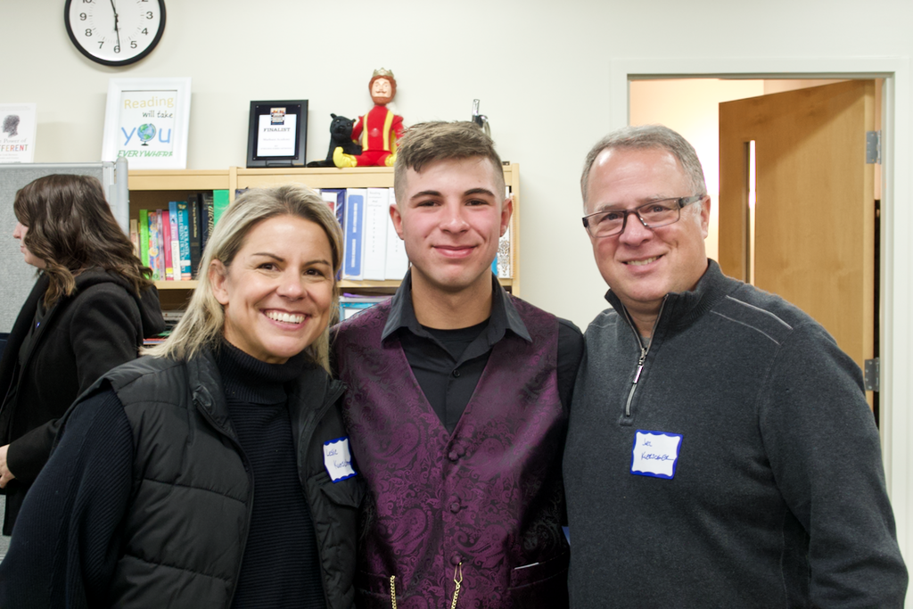 Marburn student and parents posing for a picture after NHS induction