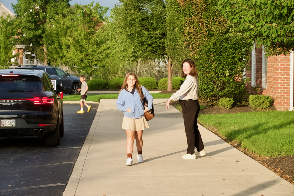 First Day - Student walking while faculty watches