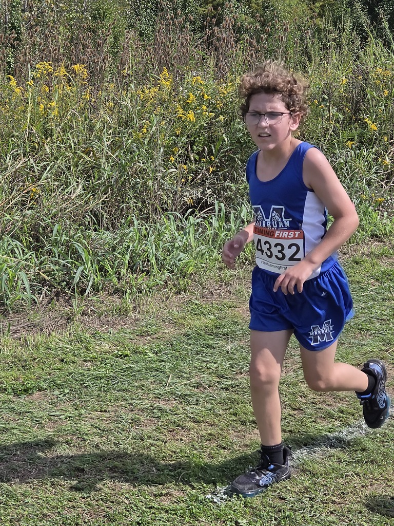 Middle Division student running in cross country meet