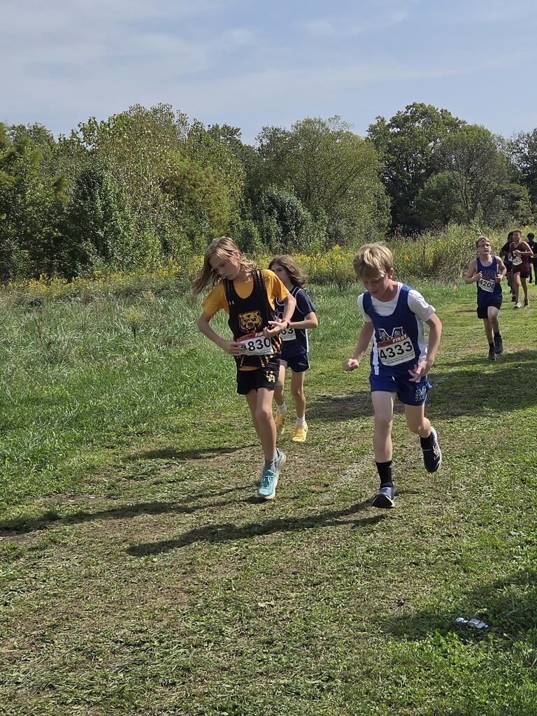 Middle Division student running in cross country meet