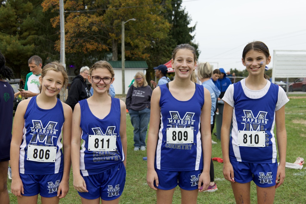 Marburn Academy Middle Division cross country runners posing before a meet