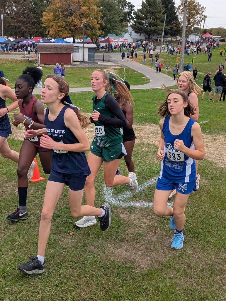 Marburn Academy high school student running in cross country meet against other runners