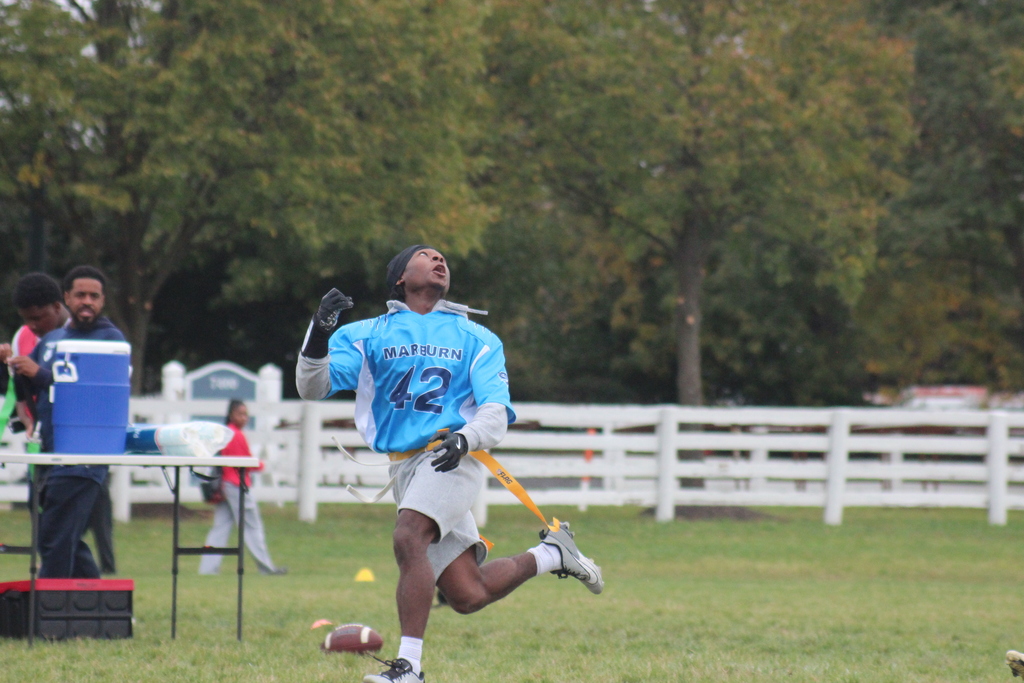 Marburn player running and looking for the pass in flag football game.