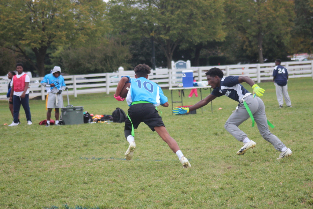 Marburn player running the ball in flag football game 