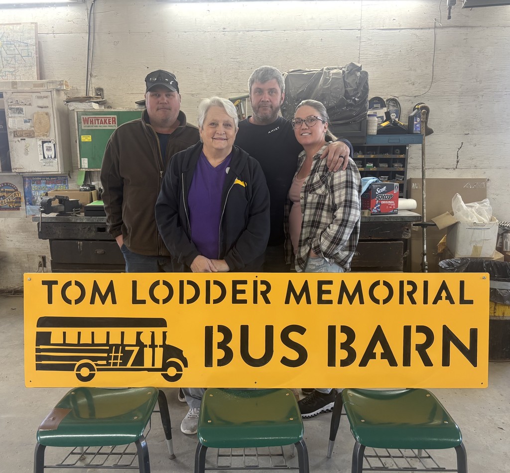 Tom's Family with the sign