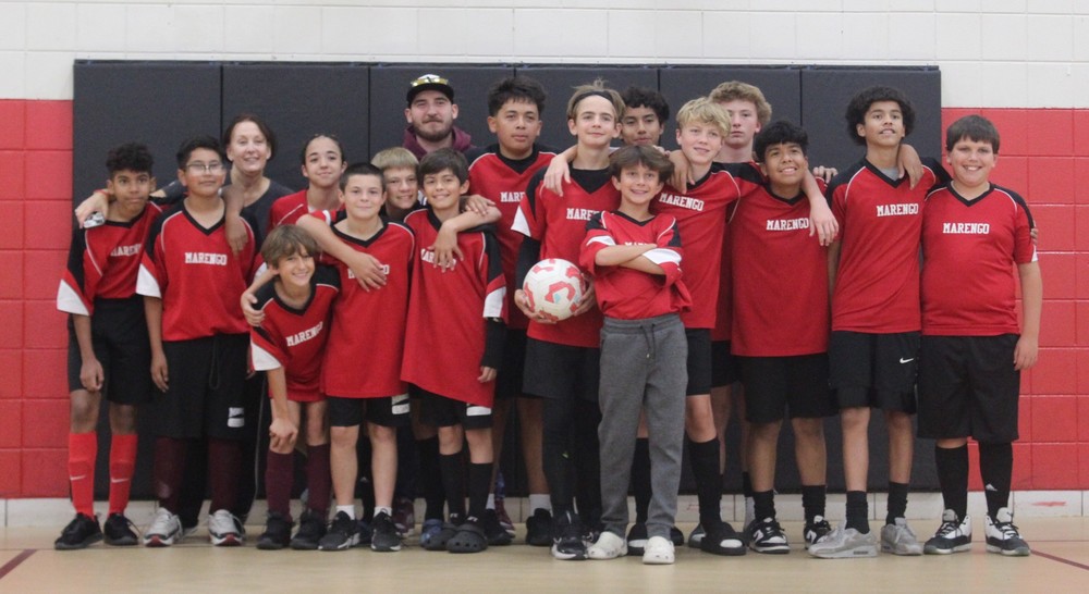 MCMC soccer team group image with coaches