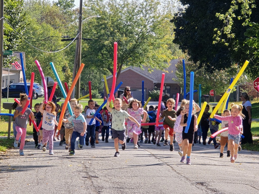Kids running with noodles