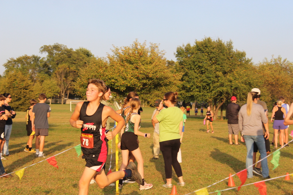 boy runs to finish line 
