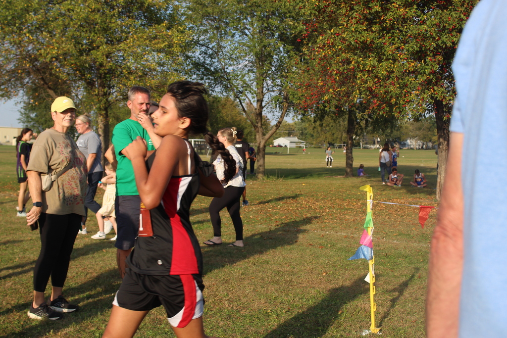 girl crosses finish line