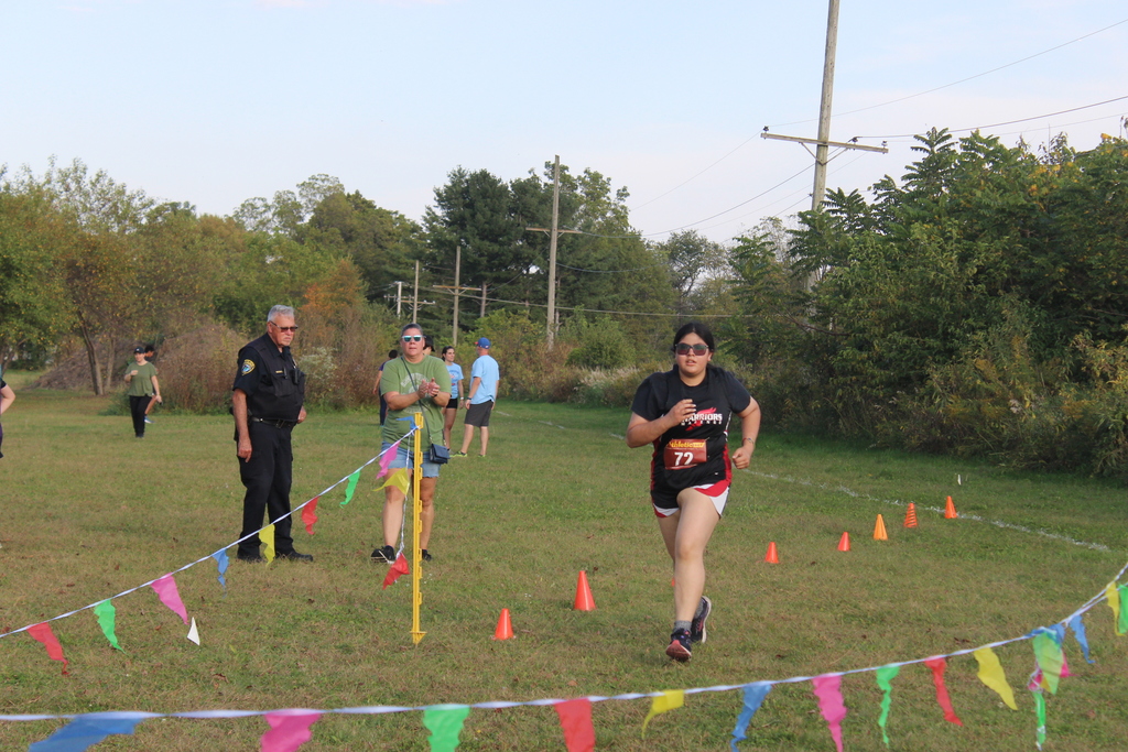 girl runs to finish line