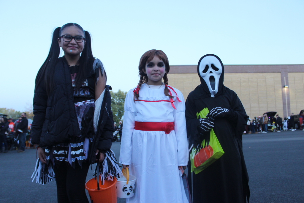 3 children dressed in costumes