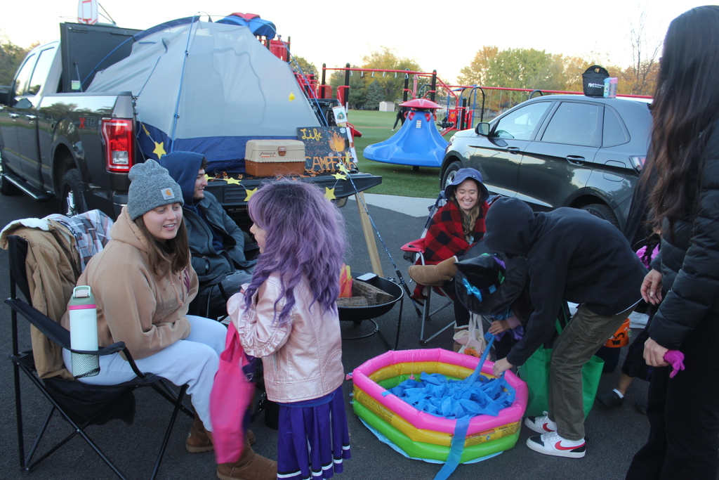 camping truck or treat display with families trunk or treating 