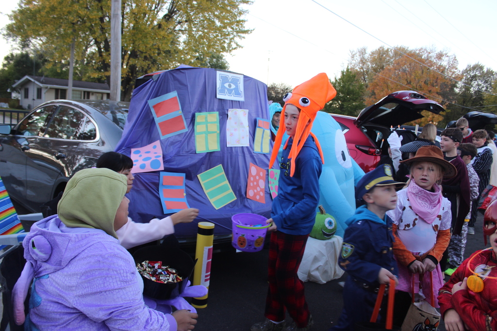 Monsters inc trunk or Treat display with children getting treats