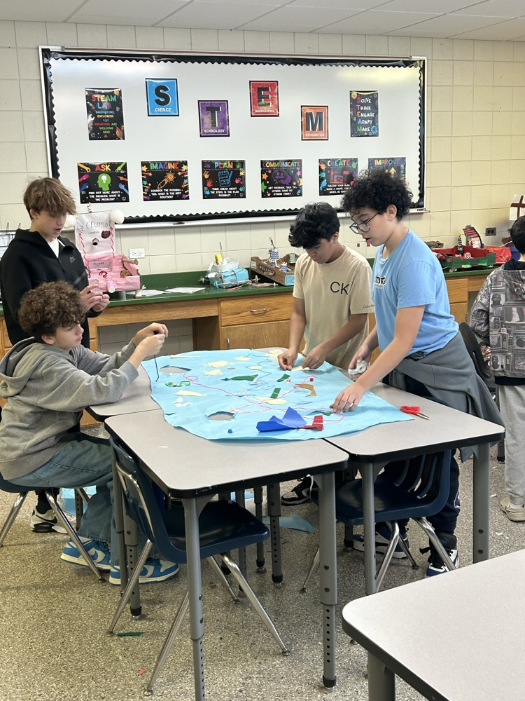 8th Grade STEM students designed an Ugly Sweater for Mr. Burke.