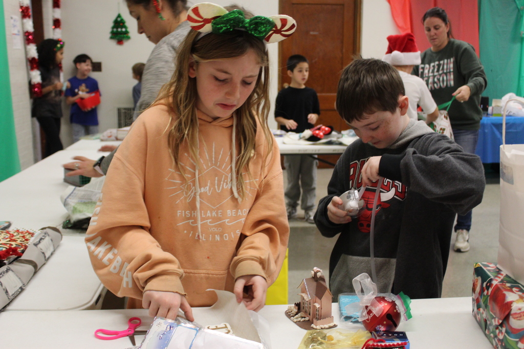 students wrapping gifts