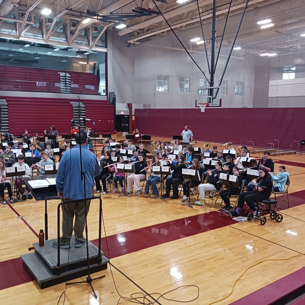 Mr. Stellmach rehearsing with students