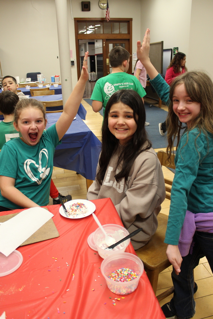 Students happy decorating cookies 