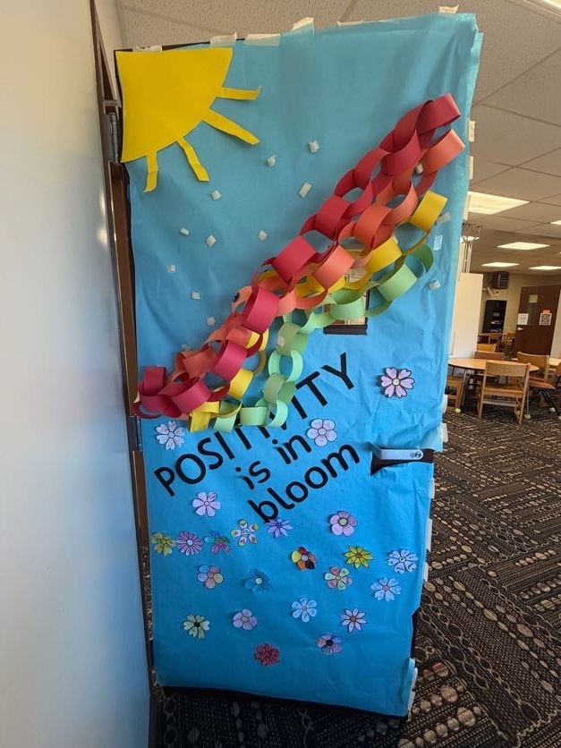 Classroom door decorated for contest with rainbow