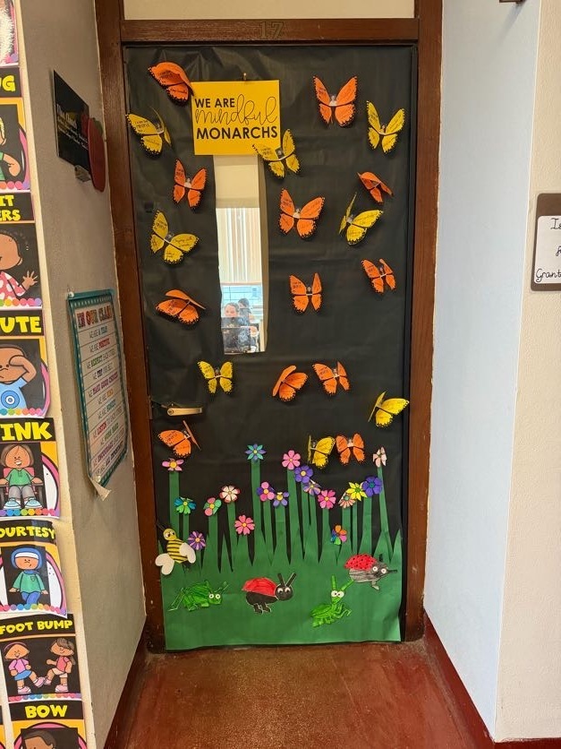 Classroom door decorated for contest with butterflies