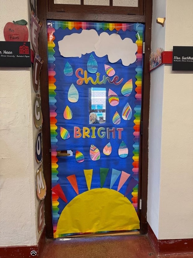 Classroom door decorated for contest with rain and shine