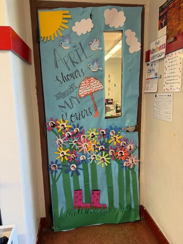 Classroom door decorated for contest with flowers