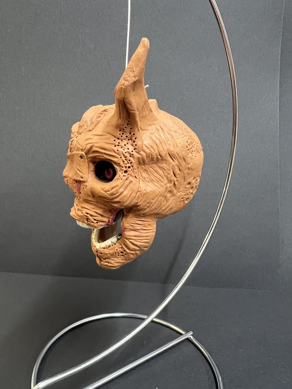 Horror Mask – Side View: A side-angle view of the horror mask highlighting its pointed ear and textured details.