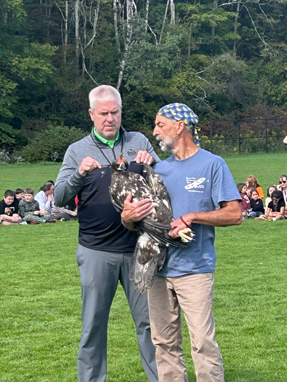 Jeremey Marks with Michael DiBenedetto ready to  release one of the eagles.