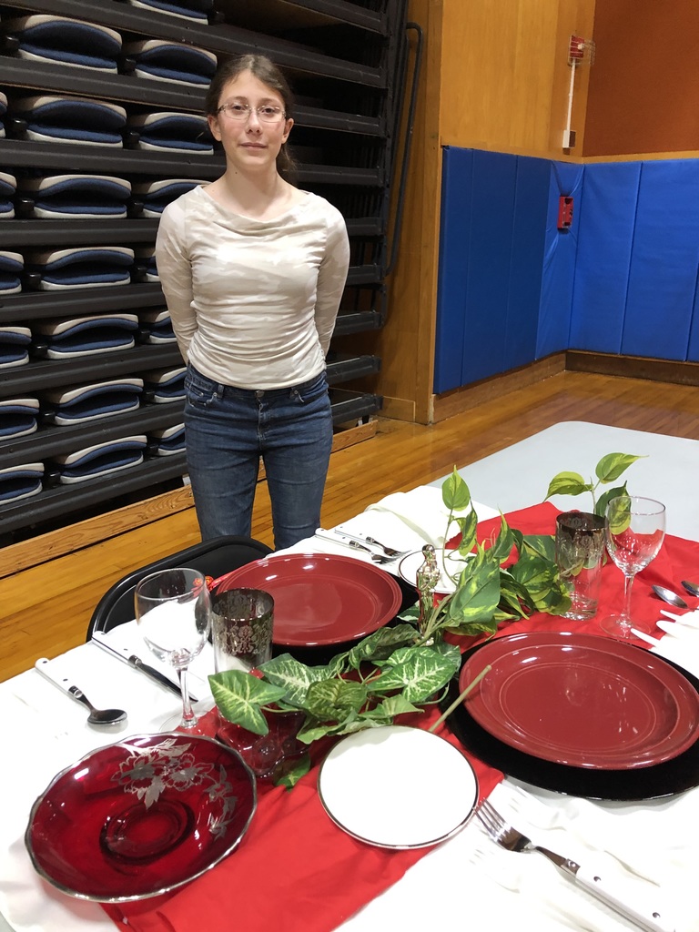 Thematic Table competitor showing off her table