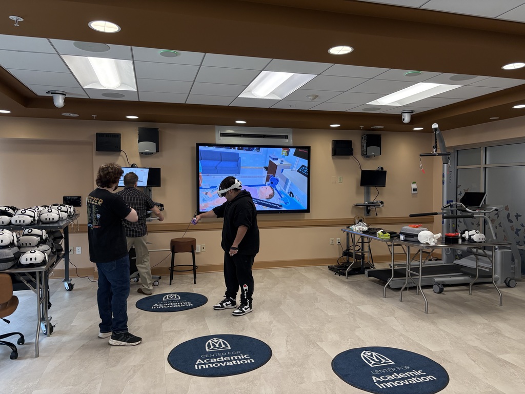 Students explored virtual reality equipment that health science students use to practice working with patients, such as nursery hospital settings.
