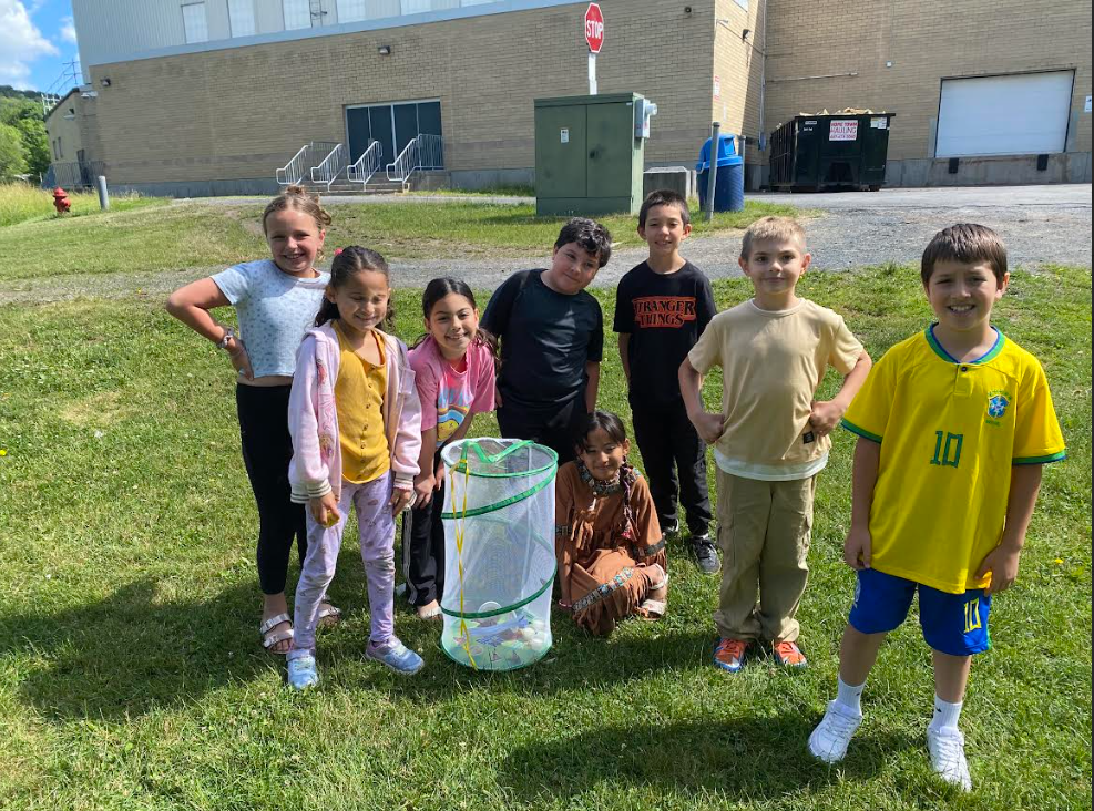 3rd grade students with butterfly ready to release