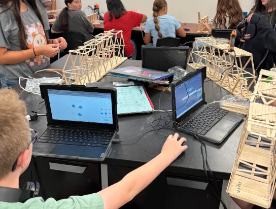 Pictures of students building bridges