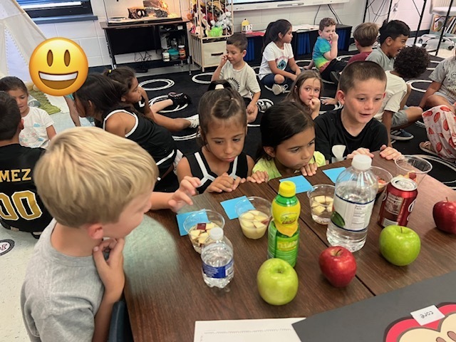 students doing apple experiment