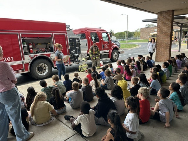 kids watching firefighter presentation