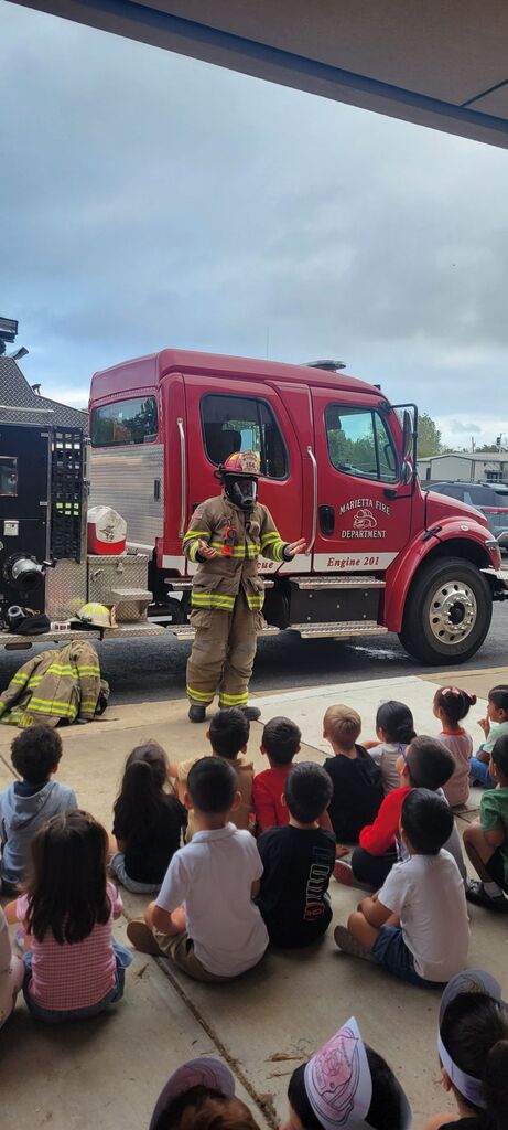 kids watching firefighter presentation