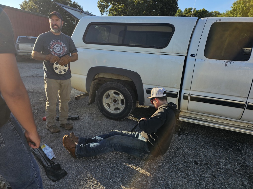 Jameson changes a tire.