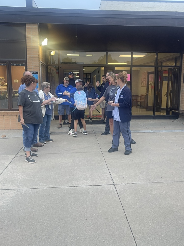 Employees of the Marion Postal Service greet a couple of MES students.