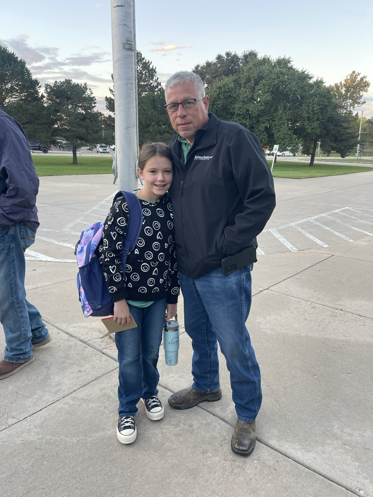 A MES student poses with her grandpa at Welcome Wednesday