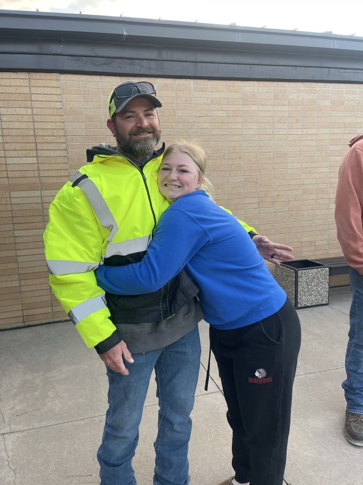 Never too old to give your dad a hug. One of the schools employees finds her dad greeting students this morning.