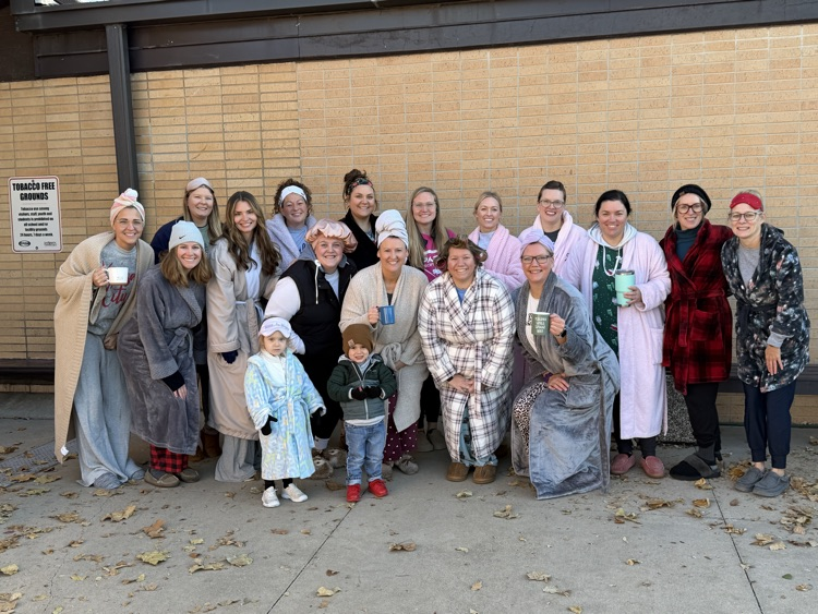 15 moms in robes roll out of bed to greet our MES students. 