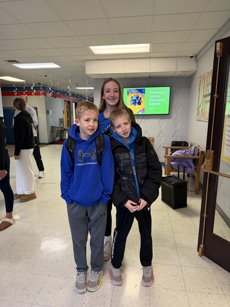 Two MES students with their older sister 