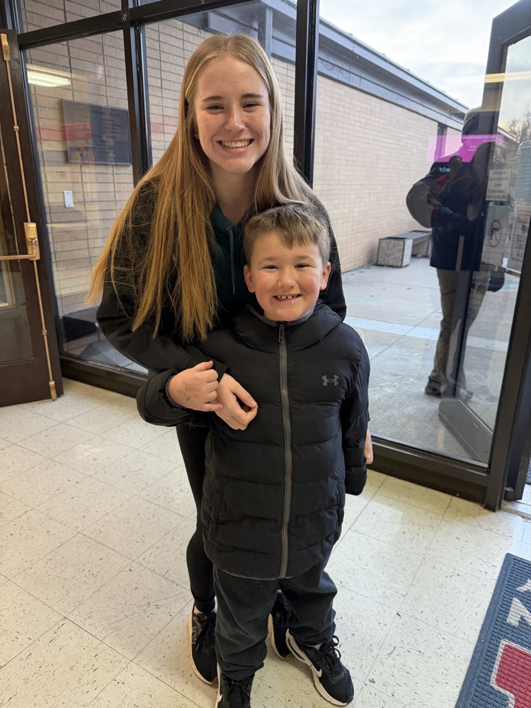 A MES 1st grader with his older sister