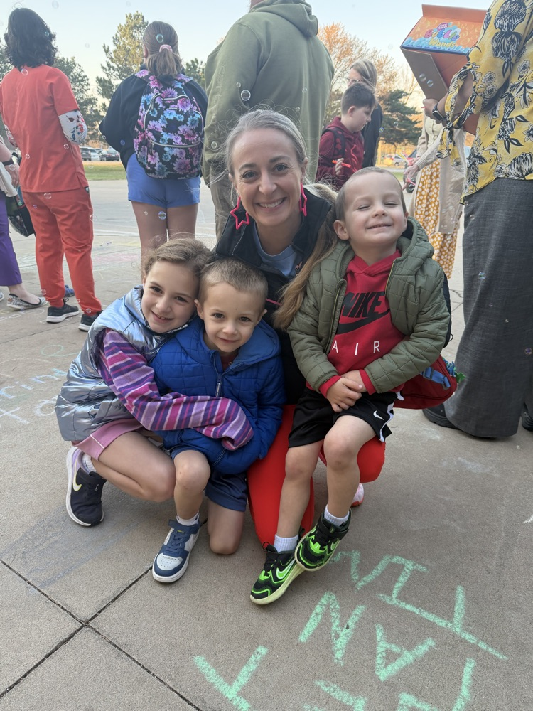 A greeter with her students