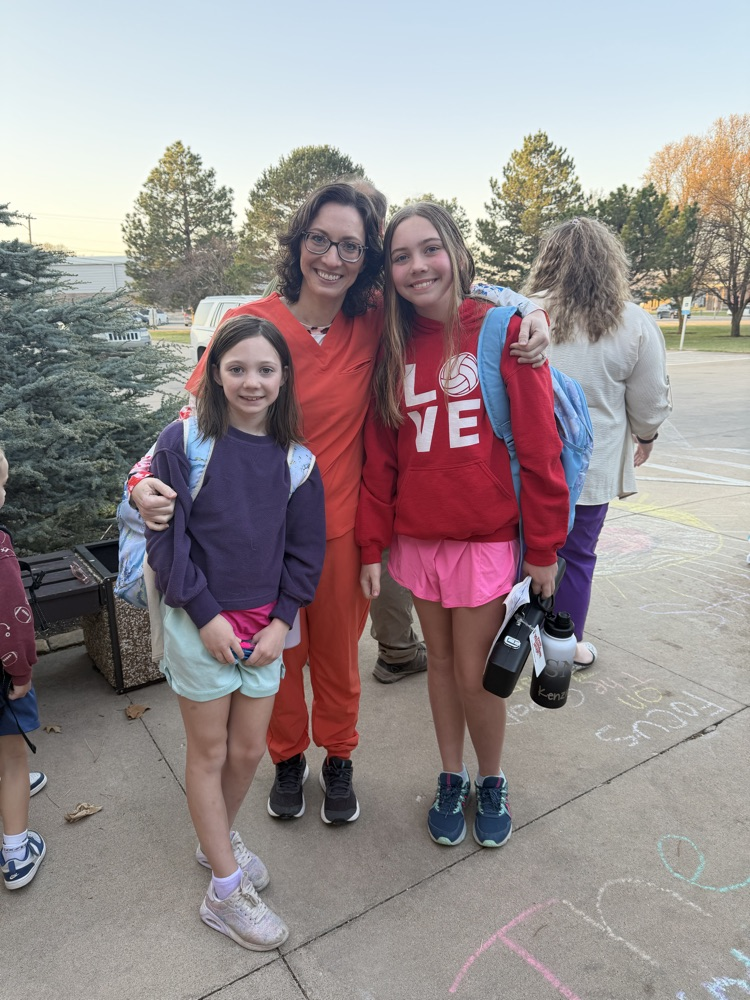 A greeter with her students