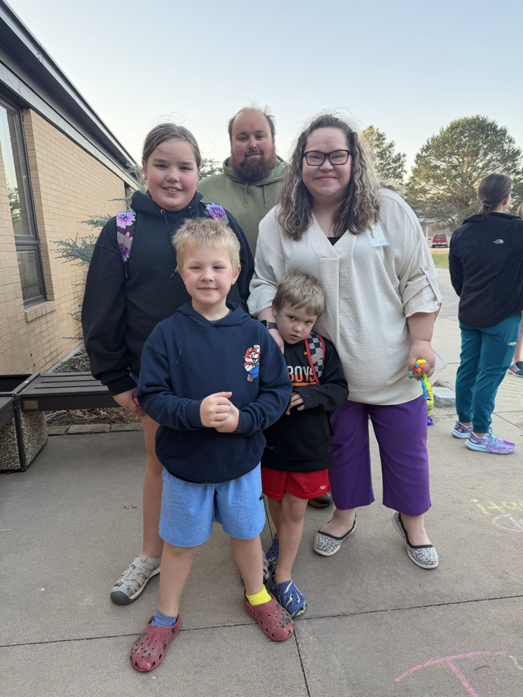 A greeter with her students 