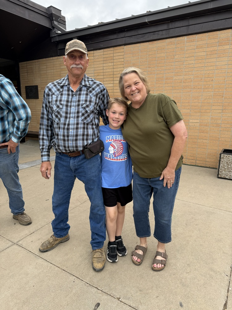 A student with his grandparents 